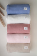 Knitted baby blankets in blue, ivory, dusty pink, light pink and beige
