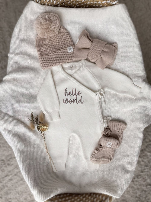 Personalised Hello World baby wrap romper with beige knitted hat, baby booties and headbow