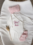 Personalised ivory wrap baby romper with pink embroidery, matching knitted headband and booties