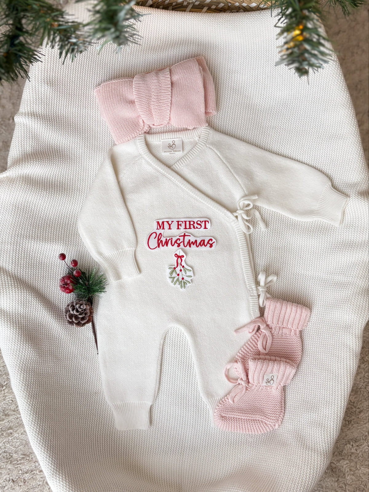 Personalised ivory My First Christmas wrap romper with pink knitted baby booties and headband