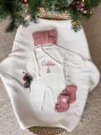 Personalised Christmas wrap romper with name and Christmas tree design, dusty pink knitted hat and baby booties